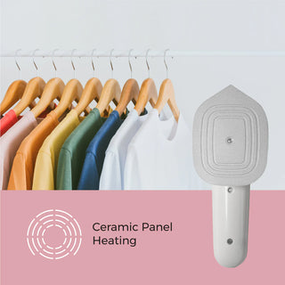 A row of colorful shirts hangs on wooden hangers in the background. In the foreground, a compact Pursonic Portable Electric Travel Iron is displayed, accompanied by text that reads "Portable Electric Travel Iron." The image background has a two-tone design with white and pink colors.