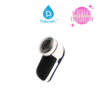 The Pursonic Fabric Shaver & Lint Remover is a compact, handheld device featuring a sleek white and black body. It boasts a large, metallic mesh head designed for effective lint removal. A pink circular badge with sparkles reading "HOTTER THAN HOT" adorns the upper right corner.