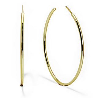 A pair of large, thin gold hoop earrings made from quality materials by Sonia Hou Jewelry. One Perfect Hoop Earring is positioned upright, showcasing its circular shape, while the other is laid flat to display its width. The polished surface reflects light, highlighting their smooth and shiny texture—ideal hoop earrings for everyday wear.