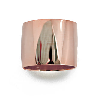 A close-up image of the Rich Chunky Wide Cigar Band Ring by Sonia Hou Jewelry, featuring a shiny, rose gold finish with a smooth, reflective surface. The ring has a slightly curved shape and appears to be polished to a high gloss, making it a grand statement that's also a wardrobe essential.